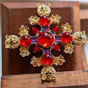 GOLD CROSS BROOCH WITH RED CABOCHONS